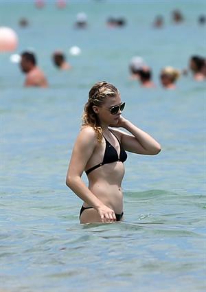 Chloe Grace Moretz candids in a Black Bikini in Miami Beach