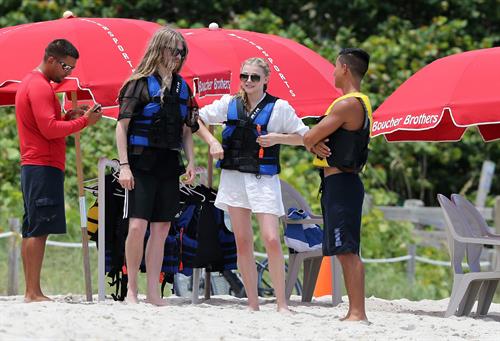 Chloe Grace Moretz candids in a Black Bikini in Miami Beach