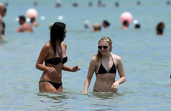 Chloe Grace Moretz candids in a Black Bikini in Miami Beach