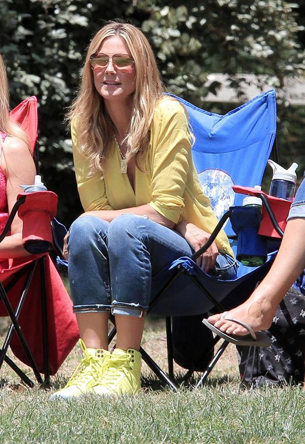 Heidi Klum out for lunch in Brentwood in a yellow shirt