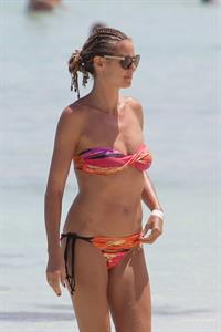 Heidi Klum wearing a bikini on a beach in the Bahamas on July 6, 2013