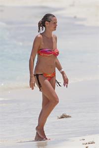 Heidi Klum wearing a bikini on a beach in the Bahamas on July 6, 2013