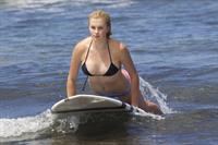 Ireland Baldwin goes paddle-boarding in Hawaii with her boyfriend Slater Trout May 26, 2013 