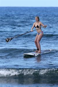 Ireland Baldwin goes paddle-boarding in Hawaii with her boyfriend Slater Trout May 26, 2013 