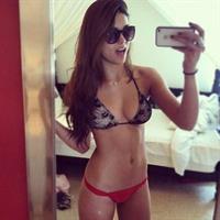 Kyra Santoro in a bikini taking a selfie