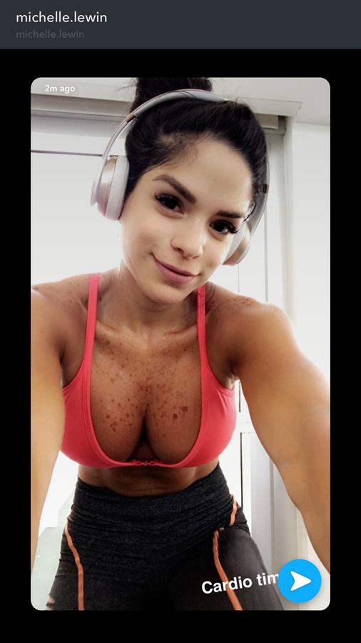 Michelle Lewin in a bikini taking a selfie