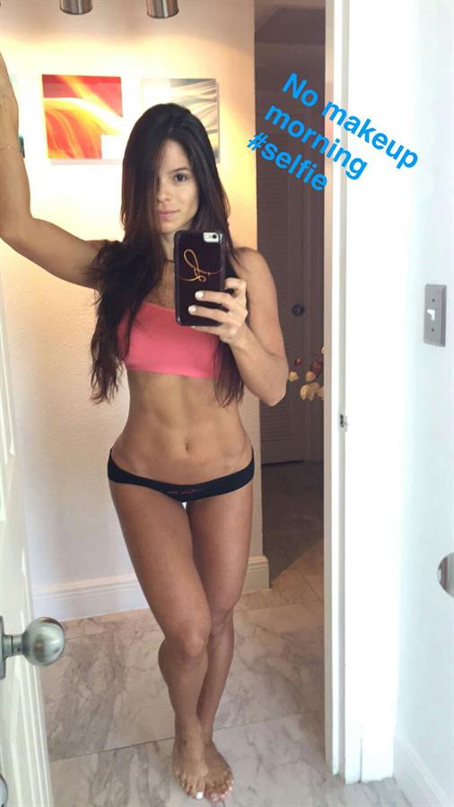 Michelle Lewin in a bikini taking a selfie