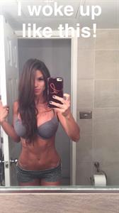 Michelle Lewin in a bikini taking a selfie