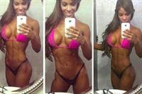 Yarishna Ayala Otero in a bikini taking a selfie