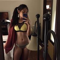 Caroline in a bikini taking a selfie