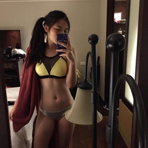 Caroline in a bikini taking a selfie