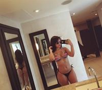 Damaris Lopez in a bikini taking a selfie