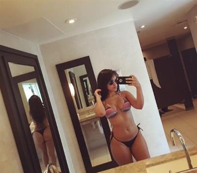 Damaris Lopez in a bikini taking a selfie