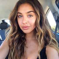 Nadia Mejia in a bikini taking a selfie