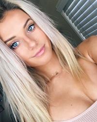 Lindsay Brewer in a bikini taking a selfie