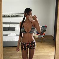 Helga Lovekaty in a bikini taking a selfie