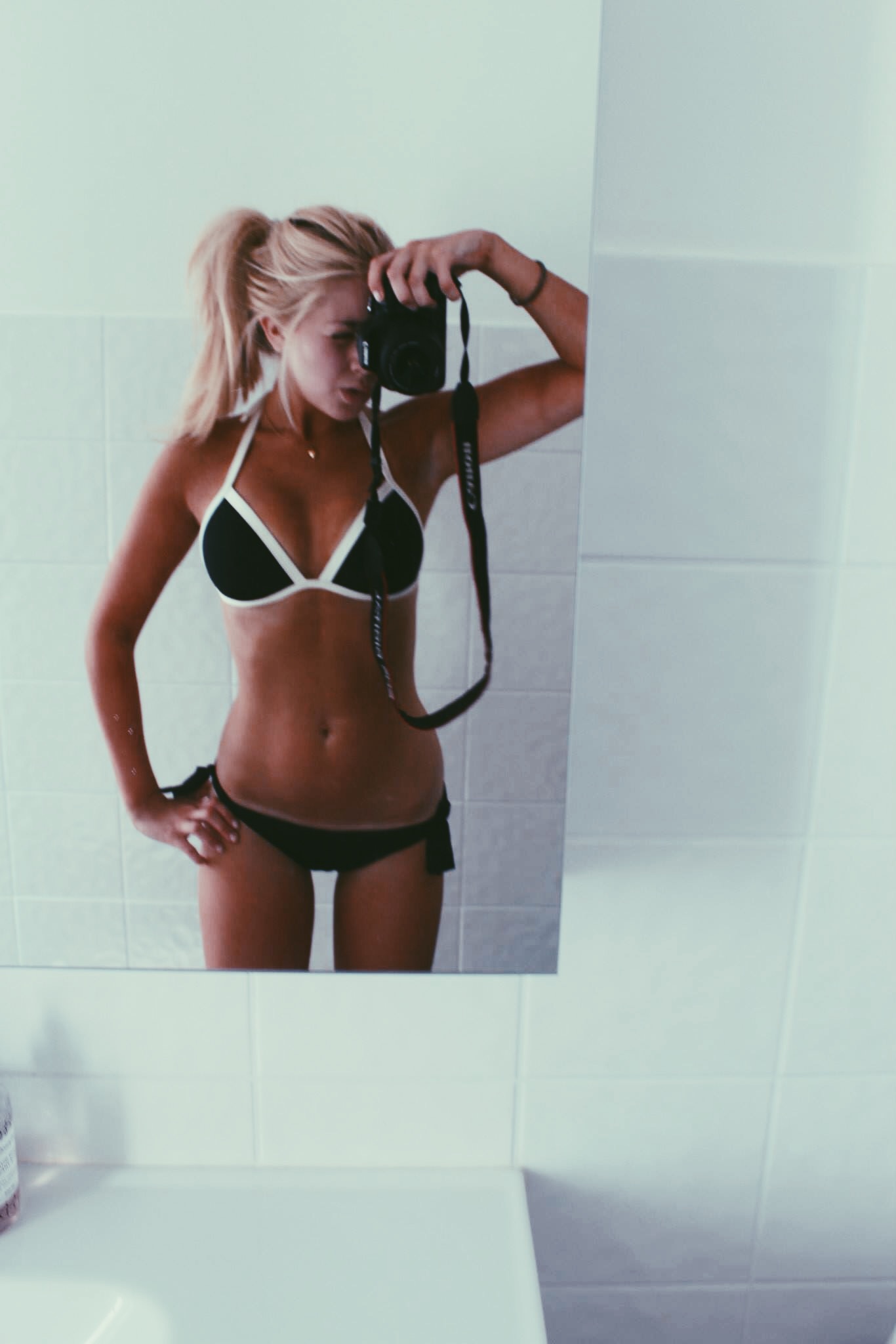 Anonymous in a bikini taking a selfie