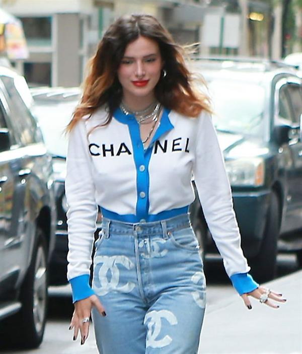 Bella Thorne braless tits seen by paparazzi showing her pierced nipple dressed all in Chanel.






