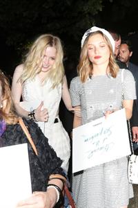 Ellie Bamber braless boobs while wearing basically a scarf as a top showing side boob cleavage.








