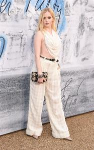 Ellie Bamber braless boobs while wearing basically a scarf as a top showing side boob cleavage.








