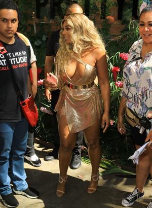 Ashanti sexy cleavage in a low cut dress at the PrettyLittleThings launch party.

