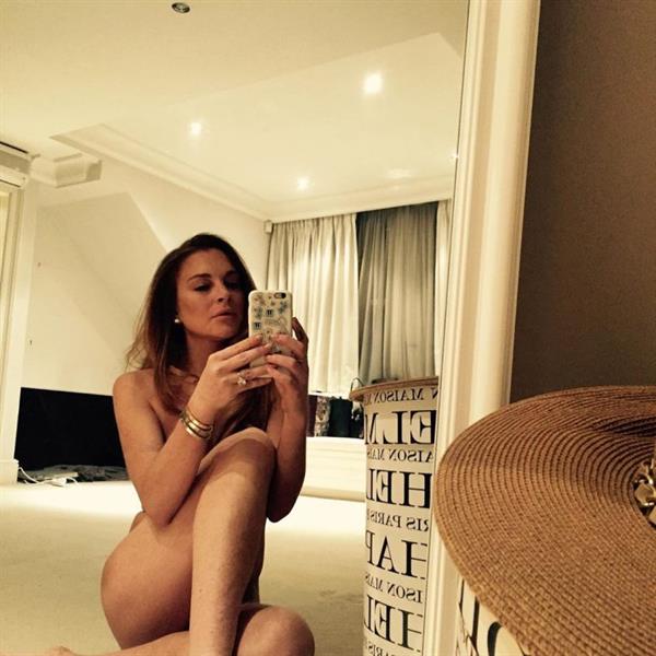 Lindsay Lohan nude shared a covered photo of herself naked.














