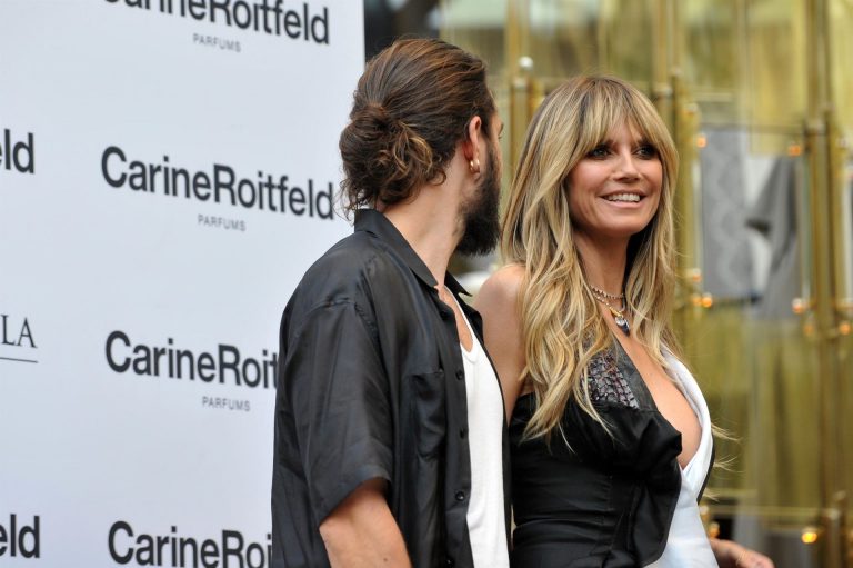 Heidi Klum Pictures Heidi Klum sexy braless cleavage showing her boobs in a black and white dress seen by paparazzi.