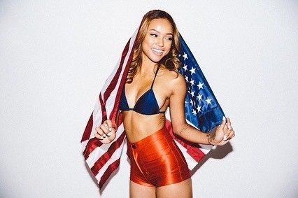 Karrueche Tran sexy in a bikini top showing some nice cleavage for the 4th of July.



