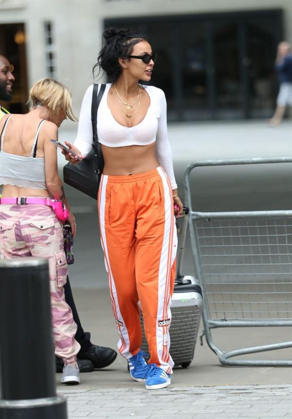 Maya Jama sexy in a crop top showing some nice cleavage seen by paparazzi.










