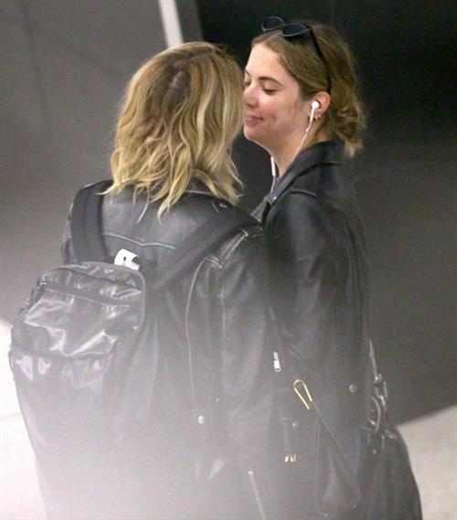 Cara Delevingne Pictures Cara Delevingne and Ashley Benson kissing at the airport.
