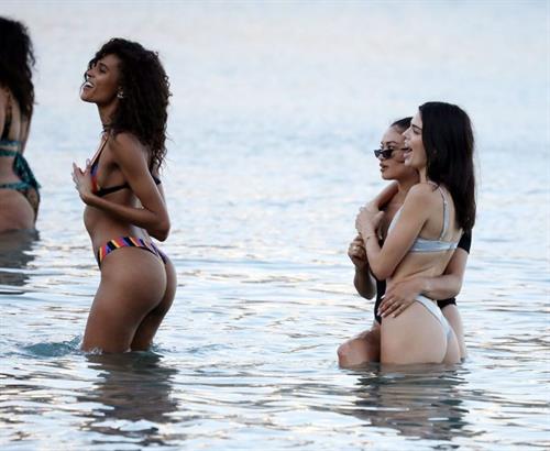 Kendall Jenner Bikini Pictures Kendall Jenner sexy ass in a thong bikini seen by paparazzi in the water at the beach.