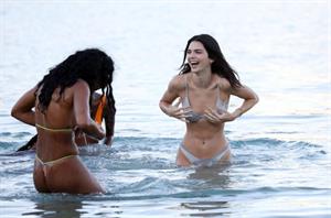 Kendall Jenner sexy ass in a thong bikini seen by paparazzi in the water at the beach.




























