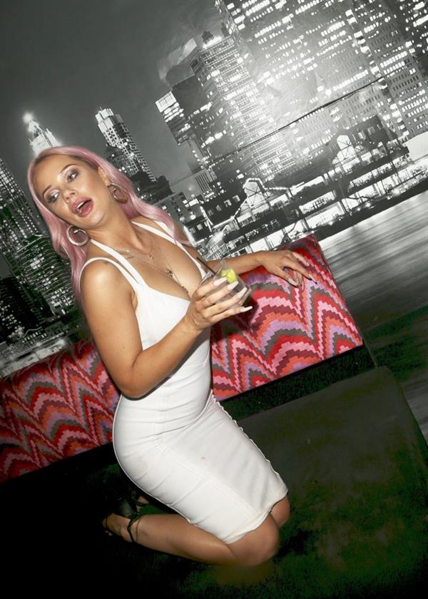 Jessika Power sexy lesbian kiss out partying in a white dress showing some nice cleavage.





