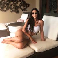 Kim Kardashian sexy little white outfit showing off her big boobs.













