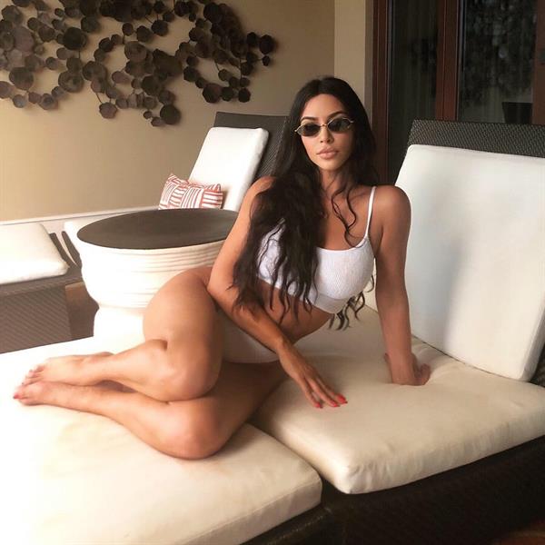 Kim Kardashian sexy little white outfit showing off her big boobs.













