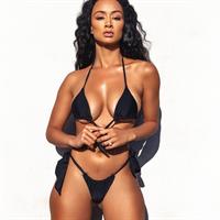 Draya Michele Bikini Pictures Draya Michele in a sexy thong bikini showing some nice cleavage.