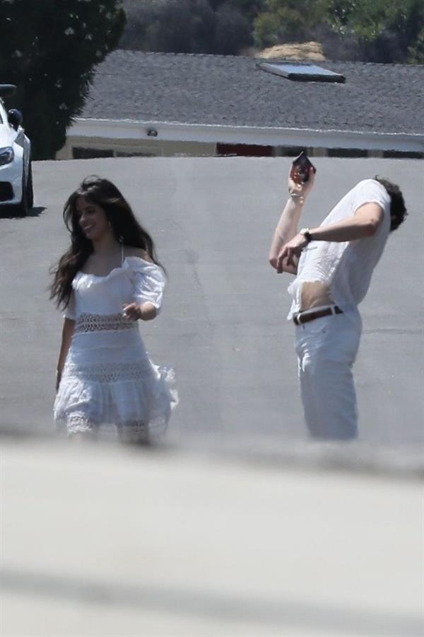 Camila Cabello sexy ass in a white dress seen with Shawn Mendes by paparazzi.


