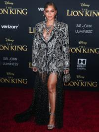 Beyonce braless boobs and areola peek showing off nice cleavage on the red carpet for the premiere of  The Lion King .






