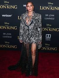 Beyonce braless boobs and areola peek showing off nice cleavage on the red carpet for the premiere of  The Lion King .






