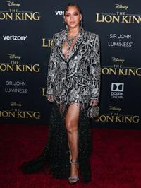 Beyonce braless boobs and areola peek showing off nice cleavage on the red carpet for the premiere of  The Lion King .






