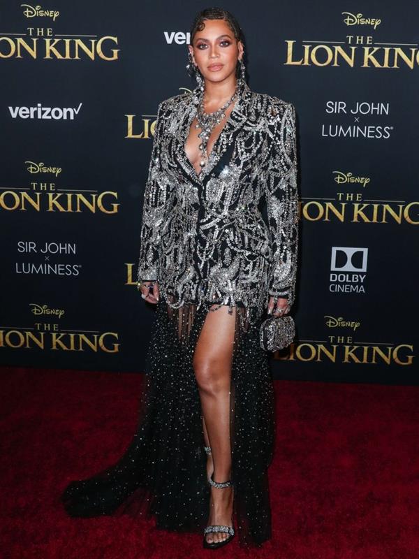 Beyonce braless boobs and areola peek showing off nice cleavage on the red carpet for the premiere of  The Lion King .






