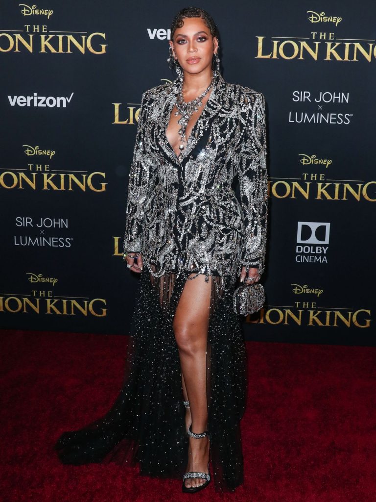 Beyoncé Knowles Pictures Beyonce braless boobs and areola peek showing off nice cleavage on the red carpet for the premiere of  The Lion King .