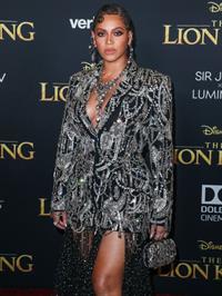 Beyonce braless boobs and areola peek showing off nice cleavage on the red carpet for the premiere of  The Lion King .







