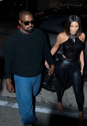 Kim Kardashian sexy in a tight leather outfit seen by paparazzi with her husband Kanye West.














