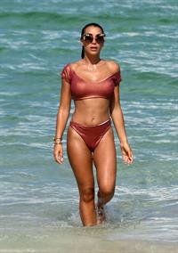 Elisa De Panicis sexy tits pokies and ass in a thong bikini seen by paparazzi.




