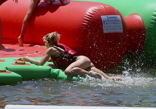 Elsa Pataky Bikini Pictures Elsa Pataky sexy ass and cleavage in a swimsuit seen by paparazzi with Chris Hemsworth.