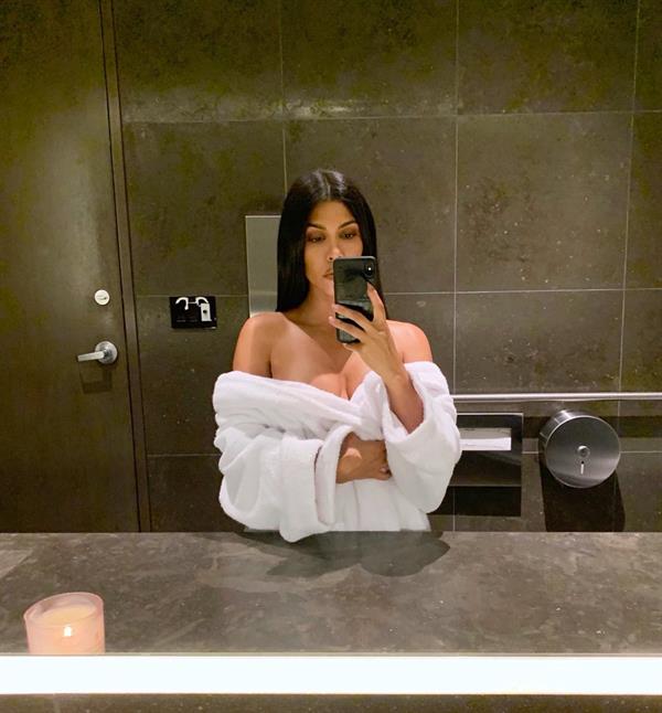 Kourtney Kardashian boobs showing some nice cleavage in just a robe.
















