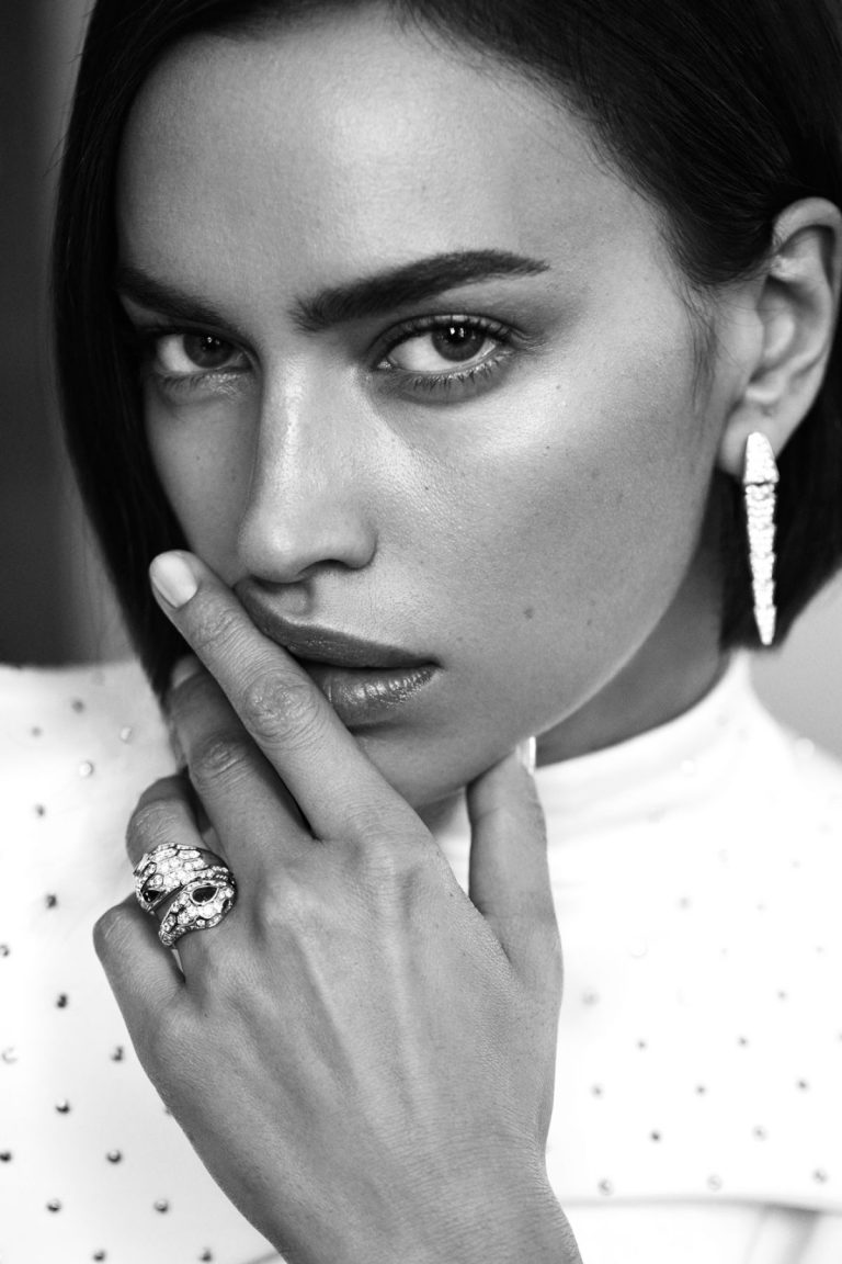 Irina Shayk Pictures Irina Shayk topless and sexy photo shoot for HarpersBazaar.com covering her nude boobs with her hands.