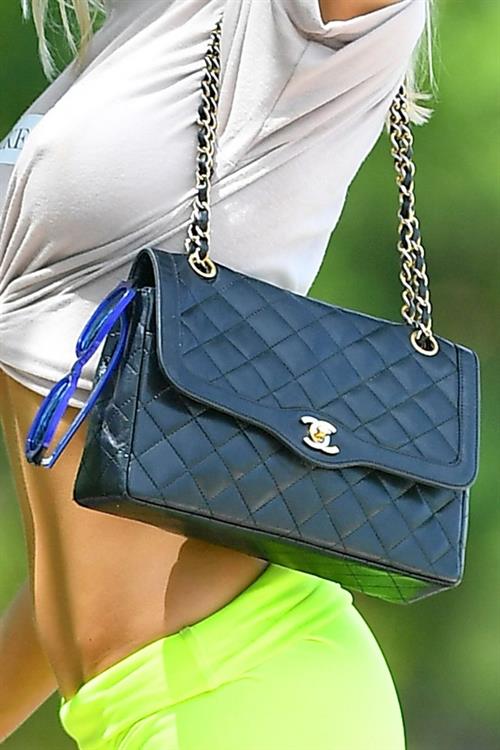 Joy Corrigan Pictures Joy Corrigan braless tits pokies and sexy ass seen by paparazzi in little green shorts.