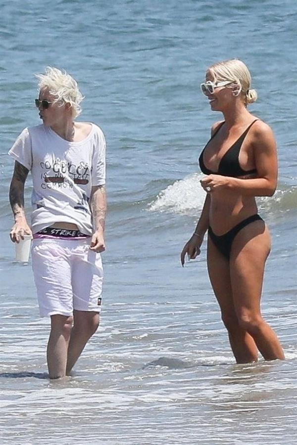 Gigi Gorgeous sexy cleavage in a bikini at the beach with Nats Getty seen by paparazzi.



